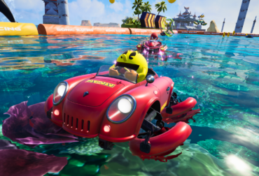 Detalhe do personagem PAC-MAN em seu veículo amarelo personalizado no grid de largada de Sonic Racing.